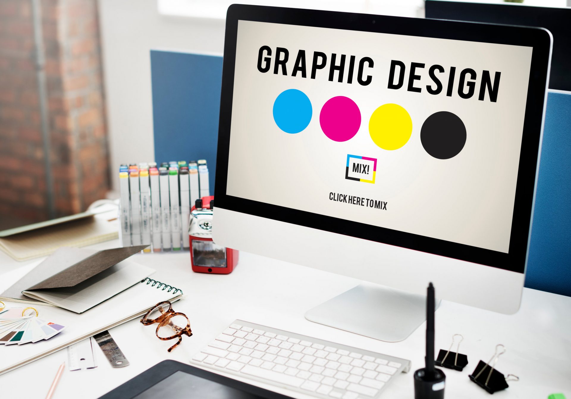 An image of a laptop with the words "Graphic Design" and some color swatches to show that I provide graphic design consulting services for wellness businesses